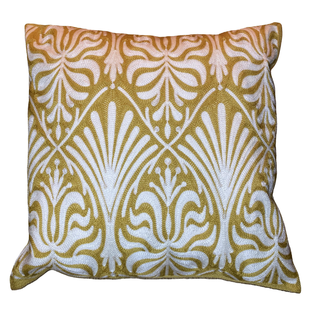 Decorative pillow with a gold and white geometric pattern on a white background