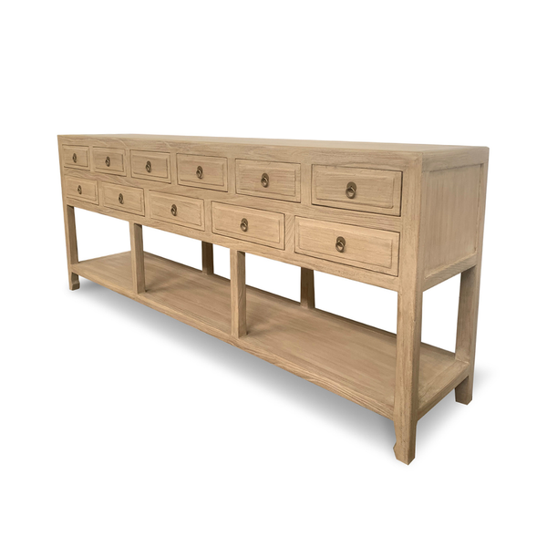 Wooden console table with multiple drawers on a white background
