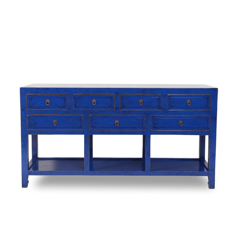 Blue console table with multiple drawers on a white background