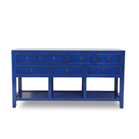 Blue console table with multiple drawers on a white background