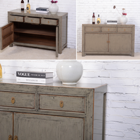 Collage of a wooden sideboard with open and closed doors against a white brick wall.