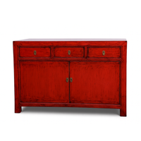 Red wooden sideboard with two doors and three drawers on a white background