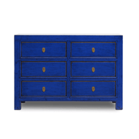 Blue dresser with six drawers on a white background