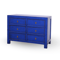 Blue dresser with six drawers on a white background
