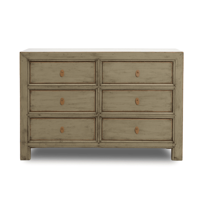 Wooden dresser with six drawers on a white background