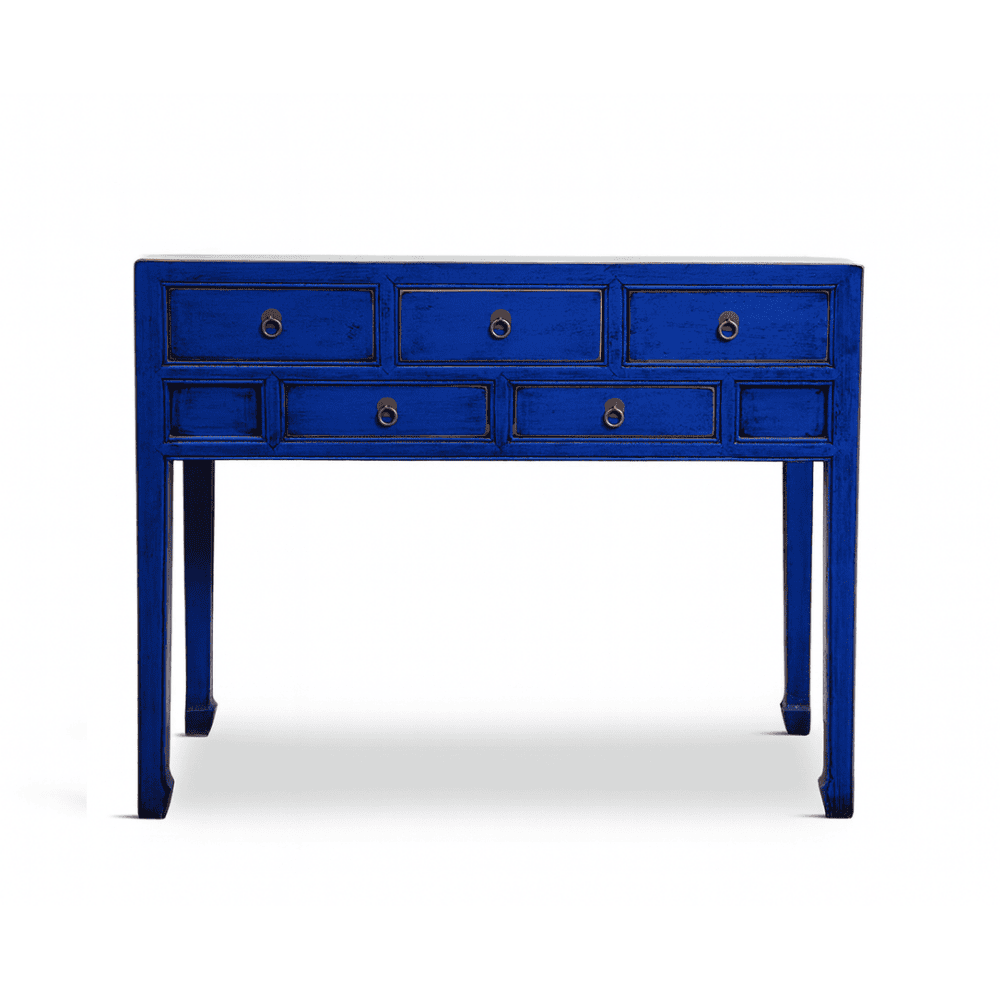 Blue console table with multiple drawers on a white background