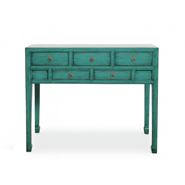 Teal console table with multiple drawers on a white background