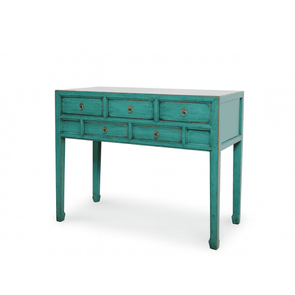 Teal console table with multiple drawers on a white background
