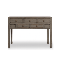 Wooden console table with multiple drawers on a white background